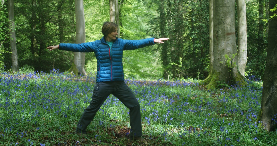 Karan demonstrating the warrior pose