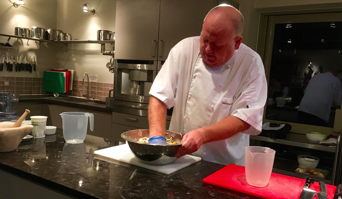 Demonstrating onion bhajis on the Indian cookery course