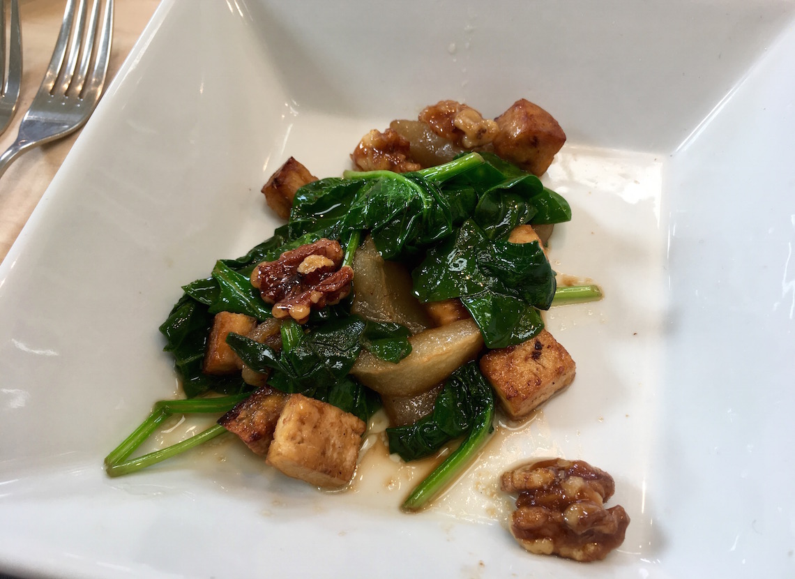 Warm pear and spinach salad on the Vegetarian Cookery Course