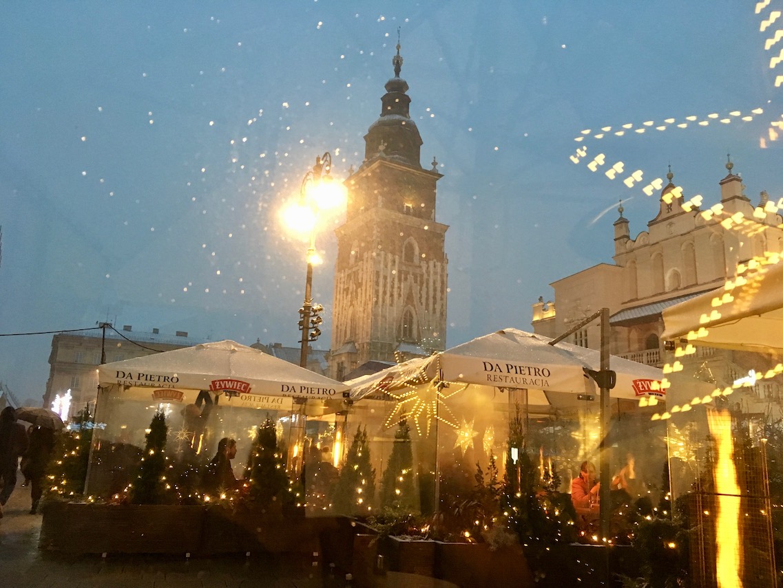 Covered cafes in the market square on a winter weekend in Krakow