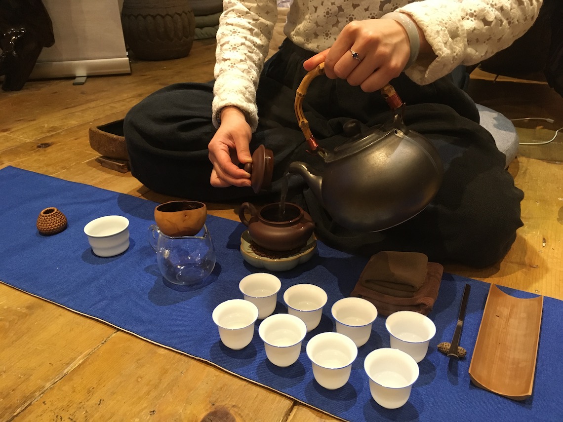 Pouring from the kettle at the tea ceremony at August Moon