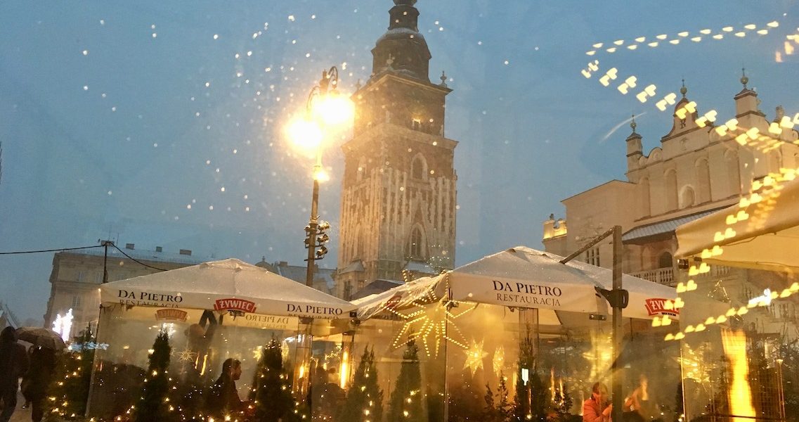 Covered cafes in the market square on a winter weekend in Krakow