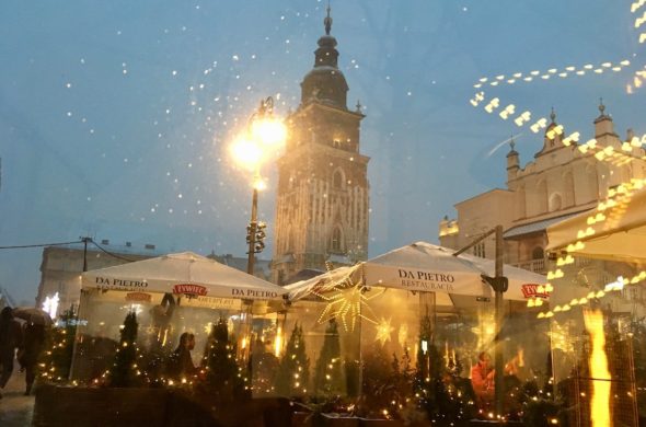 Covered cafes in the market square on a winter weekend in Krakow